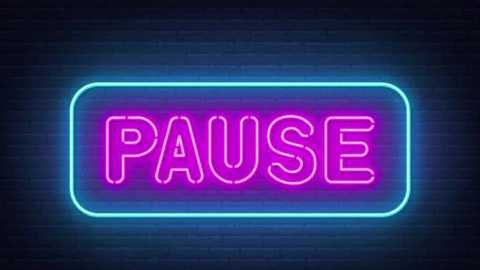 Video of a neon sign with \"PAUSE\" in bold pink letters on a blue neon outline, against a dark, textured brick wall background. The sign emits a soft glow, creating a modern, urban aesthetic.