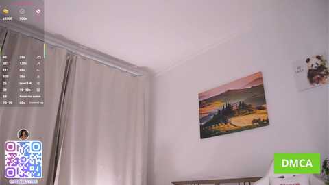 Media: Video of a minimalist, modern bedroom with a beige curtain, white walls, and a vibrant landscape painting.