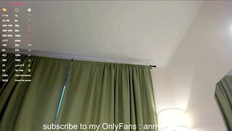 Media: Video of a light green curtain covering a window in a room, with a digital overlay of a social media post with text and a small thumbnail image.