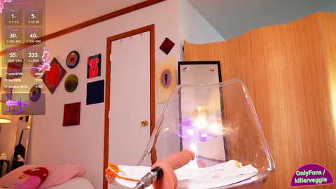 A video of a colorful bedroom with a child's messy room, a broken glass, and a smartphone screen showing a game.