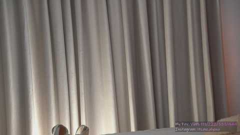 A video of a beige curtain with slight wrinkles, partially covering a white surface, possibly a bed or table. Text in the bottom right reads \"YouTube\" and \"Furry Twisted Dolls.\