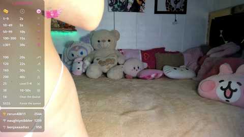 Video of a plush-filled, pink-themed bedroom with teddy bears and dolls arranged on a bed. Soft, pastel colors dominate, creating a cozy, childlike atmosphere.