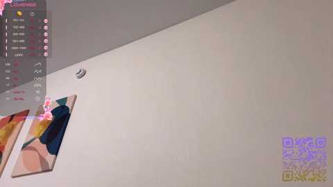 A video of a minimalist, light-colored room with a framed abstract painting on the left wall. The right wall is blank. The image also features a QR code and a Twitch chat window.