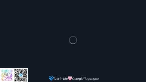 A digital image of a dark, featureless background with a faint, circular white outline near the center. Text at the bottom includes \"ink in bio\" and \"George_Tigonaco\" with a heart icon.