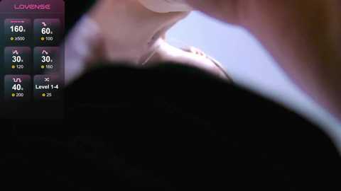 A close-up video of a man's neck and shoulder, blurred with a digital overlay displaying health stats like heart rate, oxygen levels, and temperature, indicating a \"low energy\" state.