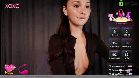 Photorealistic CGI image of a woman with long dark hair, wearing a plunging black top, standing against a dark background.