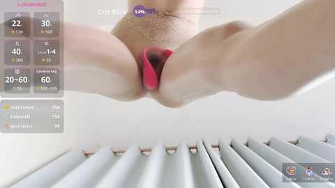 Video of a close-up, dynamic scene: a person's hand holding a red vibrator against their vulva, with a digital interface displaying stats like \"20-60\" and \"COTEX.\" The background shows a white wall and a radiator.