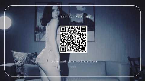 A video of an Asian woman in a light, sheer nightgown, posing provocatively in a dimly lit room with a QR code overlay.