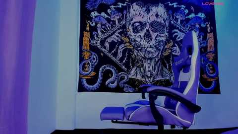 A video of a dark, ornate tapestry depicting a skull and snake design hangs behind a white ergonomic office chair. The room is lit with blue and purple hues, enhancing the eerie, mystical atmosphere.
