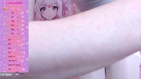 Video of a close-up of a light-skinned arm with a tattoo, overlaid with a virtual chat interface. The background features a smiling anime character with pink hair.