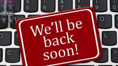 Video of a red, square warning sticker on a black keyboard with white letters reading, \"We'll be back soon!\" The sticker partially covers the keyboard's letter \"L.\