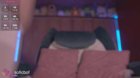 Media: A blurry, low-quality photo of a person in a bed with pink sheets and a teal blanket, featuring a virtual reality headset and a partially visible screen with a user interface.