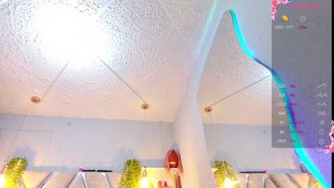 A video of a modern, bright room with a textured white ceiling, three hanging potted plants, and a blue neon light. The image appears to be a 360-degree photo, with a virtual reality interface on the right.