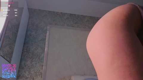 Video of a close-up, dimly-lit room with a large, bare, pale buttock in the foreground. The background features a textured wall and a partially visible door. A \"Bella Thorne OnlyFans\" watermark is visible in the top left corner.