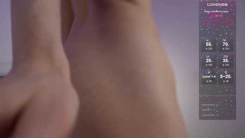 Video of a person's upper torso, displaying skin tone and muscle definition, with a graph in the background displaying various health metrics like heart rate and oxygen saturation.