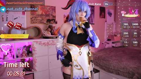 Video of a blue-haired cosplayer in a revealing, white-and-black outfit with a gold belt, standing in a pink-lit bedroom. Dice and cards are visible.