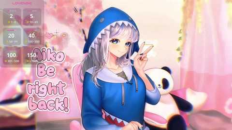 This is a digital anime-style illustration featuring a cute girl with silver hair, wearing a blue shark hoodie, holding a phone. She sits in a pink chair, surrounded by soft, pastel decor. Text reads, \"Miko Be Right Back!\