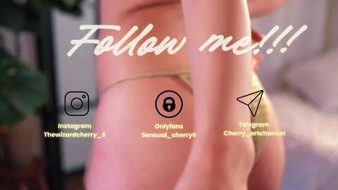 Video of a woman's side profile in a gold thong, with a tattoo of a key on her left hip. Text overlays include \"Follow me!!!\" and Instagram handles for \"TheWartcherry\" and \"OnlyFans... Sensual, Cherryarchangel\".