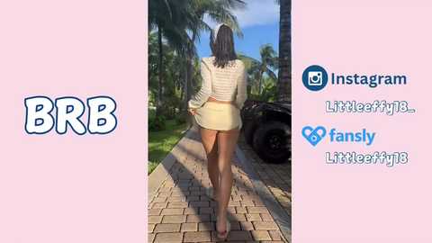 A video of a woman walking away on a paved path, wearing a white crop top and short skirt, surrounded by palm trees and a black car.