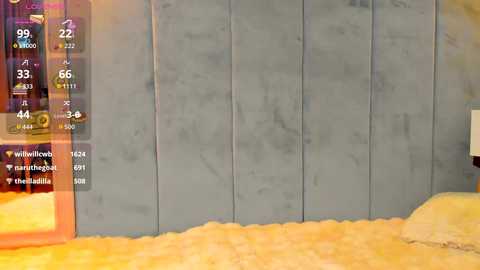 A video shows a gray, textured wall with a yellowish-orange carpeted floor, overlaid with a virtual temperature display indicating 69 degrees Fahrenheit.