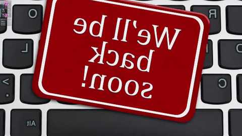 Video of a red, square, white-bordered warning sticker on a black keyboard, with bold white text reading \"WARNING! DO NOT USE!\" in a serif font.