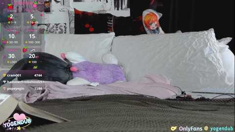 Video of a plushy rabbit in a cozy, cluttered room with a white couch, anime posters, and a YOUGUB watermark.