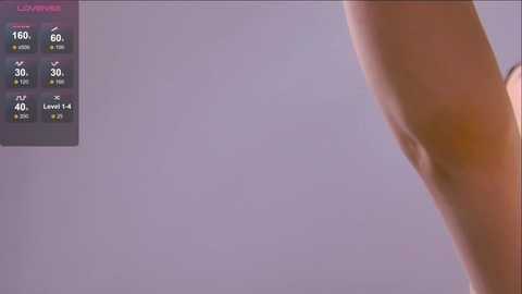 A video of a pale-skinned, nude torso with a prominent rib cage, against a blurred, gradient purple background. The left side displays a health monitoring screen with vital signs.