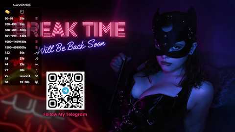 Media: Video of a dark-haired woman in a black leather corset and cat mask, holding a whip, against a neon-lit, dimly lit background with \"Break Time\" text. QR code and phone number displayed.