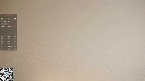 Media: Video of a beige wall with a QR code sticker on the left and a faint, barely visible reflection of a person in the upper right corner.