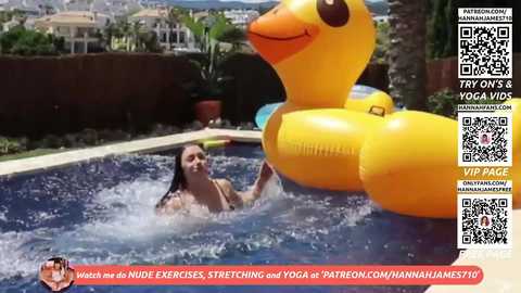 Video of a young woman with fair skin, long brown hair, and medium breasts, stretching in a pool with inflatable ducks. Background shows a lush garden and distant cityscape.