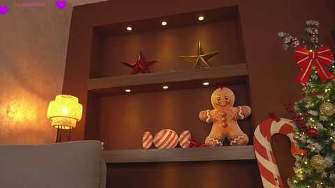 Video of a cozy Christmas-themed living room with a decorated tree, gingerbread cookies, striped candies, and a red star on a dark wooden shelf, illuminated by warm yellow lights.