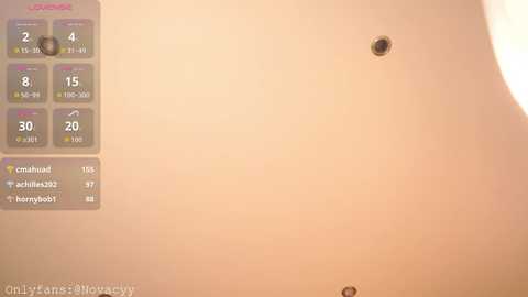 Video of a white ceiling with a small black hole, featuring a control panel with digital readouts displaying temperatures and humidity levels.