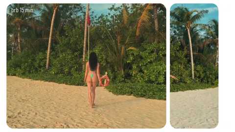 Video of a slender woman with long black hair in a green bikini walking on a sandy beach surrounded by lush greenery and palm trees.