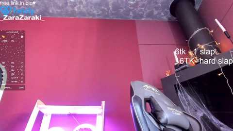 A video of a red-walled room with a black industrial fan, a white ladder, and a white light strip. Text reads \"6 clicks hard slap.\