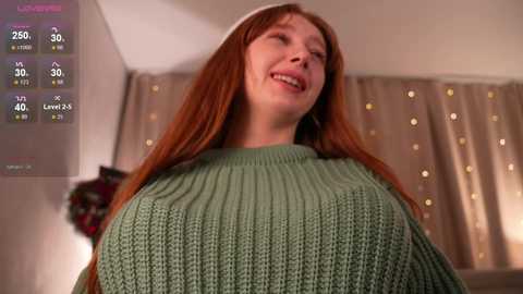 A video of a smiling woman with long, straight red hair wearing a green knitted sweater, taken indoors with a virtual reality overlay showing fitness stats.