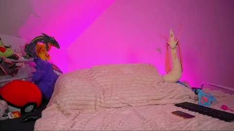 Video of a cluttered bedroom with a large, plush, white bear on a bed, a bright pink glow, a blue helmet, and a red toy on the left side.