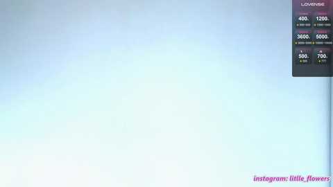 Video of a serene, light blue sky with a digital overlay of a flower-themed Instagram feed, displaying likes and comments.