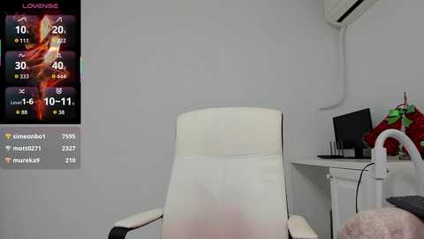 Video of a minimalist white office chair, desk, and wall-mounted air conditioner. Left side shows a colorful digital thermometer display.