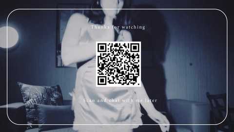A blurry, sepia-toned video of a woman in a white dress, taken from a security camera, with a QR code overlay.
