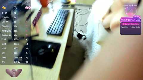 Video of a messy desk with a black keyboard, mouse, and papers, with a blurred person's hand in the foreground, featuring a \"Wild Central Live\" overlay.