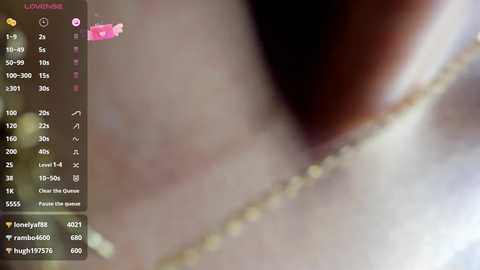 A blurry video with a soft focus, showcasing a close-up of a human eye. The image is digitally enhanced with a pink flower overlay, and includes text and icons indicating camera settings.