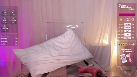 Video of a hospital bed with a white sheet, halo effect, and glowing icons indicating \"10:50,\" \"40,\" and \"View\" on a pink and white background.