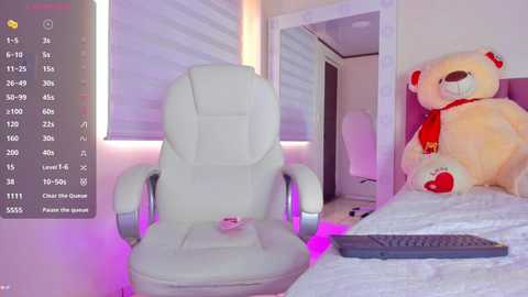 A video of a plush teddy bear with a red bow tie and a white leather gaming chair in a cozy, well-lit room with soft purple lighting.