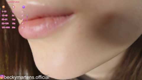 A close-up video of a woman's upper lip and cheek, showcasing a clear complexion with subtle makeup. The image includes text overlays from a live stream, indicating the user is @beckymarsons_official.