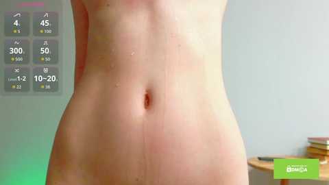 Video of a nude, fair-skinned person with a flat stomach, featuring a digital display showing fitness stats like heart rate, steps, and calories burned. Background includes a blurred, light-colored room with a wooden table and books.