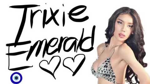 Video of a young woman with long, wavy black hair, wearing a black and white sequined bikini top, with the words \"Tricia Emerald\" in black script and a blue eye symbol at the bottom.