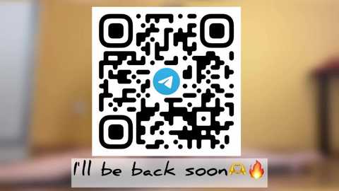 Video of a QR code with a blue \"play\" icon on a white background, overlaid with a handwritten message, \"I'll be back soon,\" in a playful font with a flame emoji.