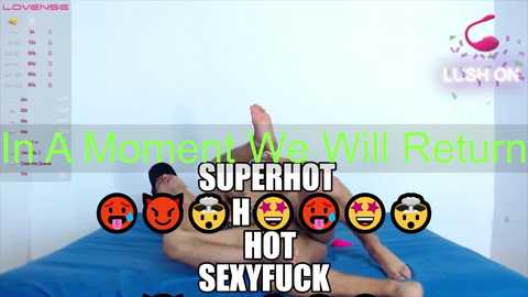 Video of a nude man with an erect penis lying on a blue bed, superimposed with text: \"I'll A Men Will Return,\" \"SUPERHOT HOT SEXYFUCK.\