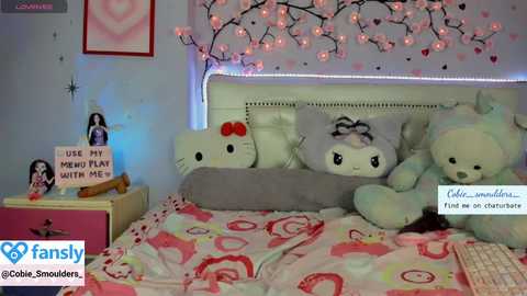 Video of a pink-themed, Hello Kitty-themed bedroom with plush toys, a plush bedspread, and a soft, cozy ambiance.