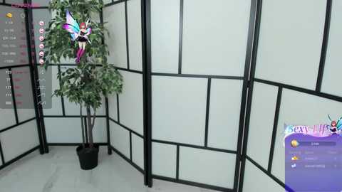 Video of a modern office cubicle with a tall, potted plant, black-framed frosted glass panels, and a \"Breastly\" app interface in the background.